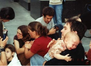 Don Joughin comforts his eleven-month-old son after the infant was doused in pepper spray by one of Portland's "Finest."